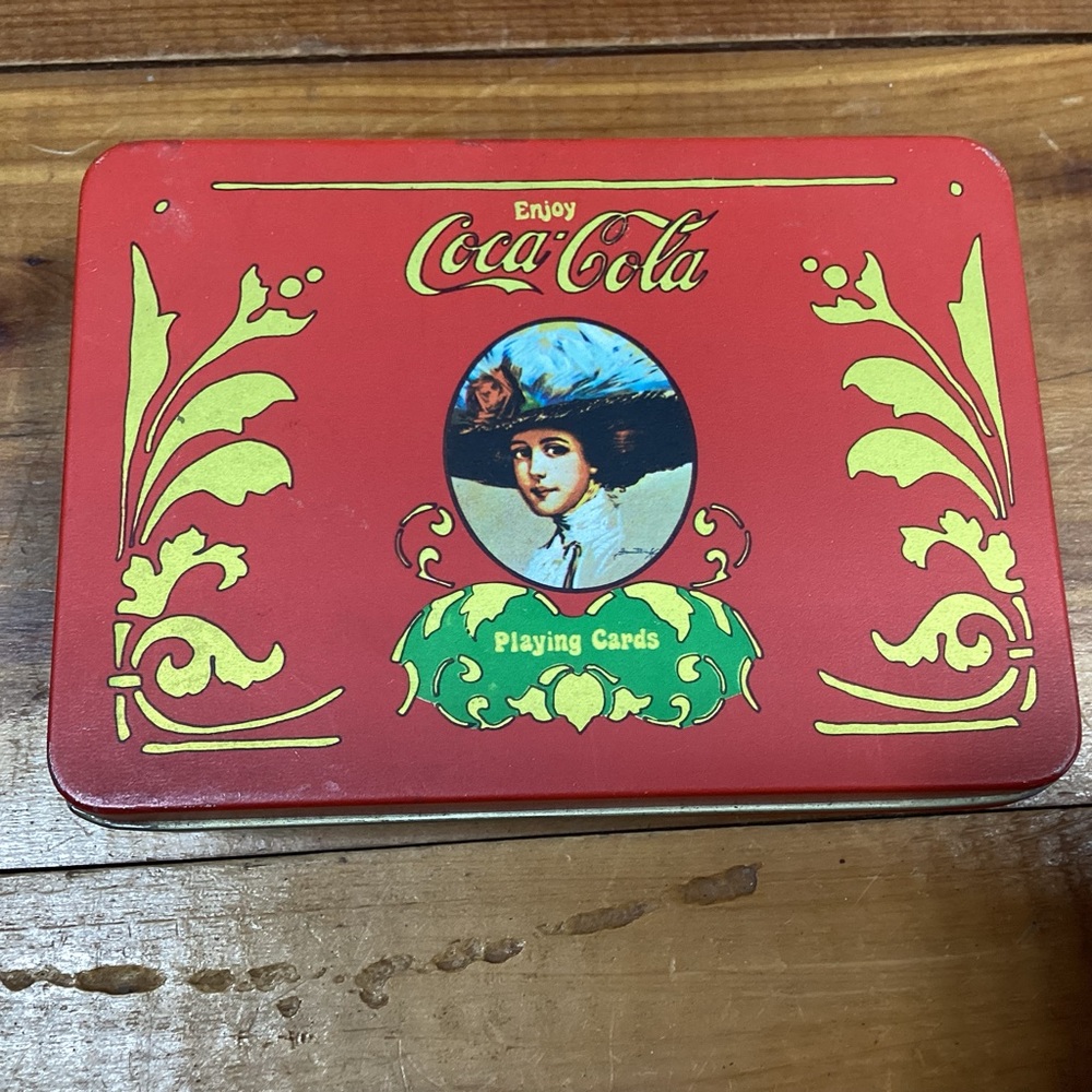 Coca Cola tin box with 2 card decks 4 dice and score pad and pencil